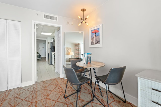 2000 N Ocean Blvd Unit 1206, Myrtle Beach, SC 29577 - dining room with a chandelier and baseboards