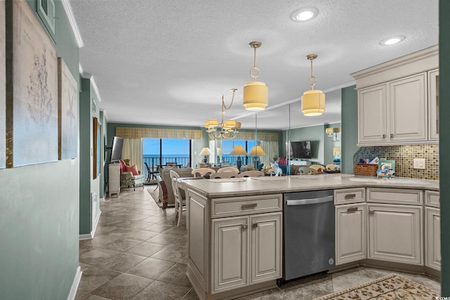 517 S Ocean Blvd Unit 705, North Myrtle Beach, SC 29582 - kitchen with dishwasher, open floor plan, a peninsula, a textured ceiling, and light countertops