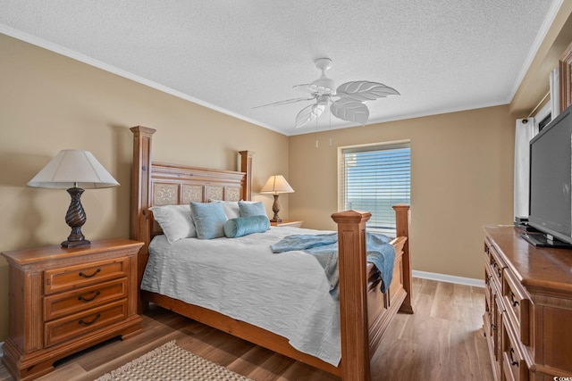 517 S Ocean Blvd Unit 705, North Myrtle Beach, SC 29582 - bedroom with a textured ceiling, light wood-type flooring, a ceiling fan, and ornamental molding