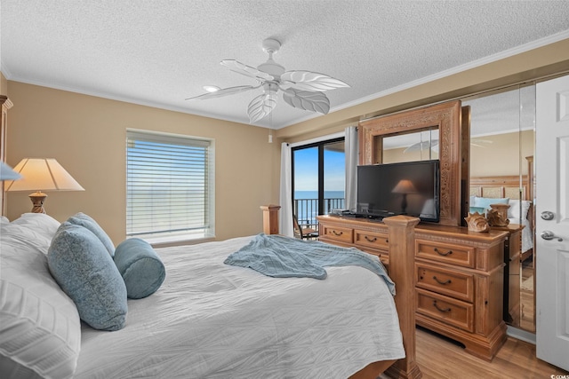 517 S Ocean Blvd Unit 705, North Myrtle Beach, SC 29582 - bedroom with access to outside, a textured ceiling, light wood-style flooring, a ceiling fan, and crown molding