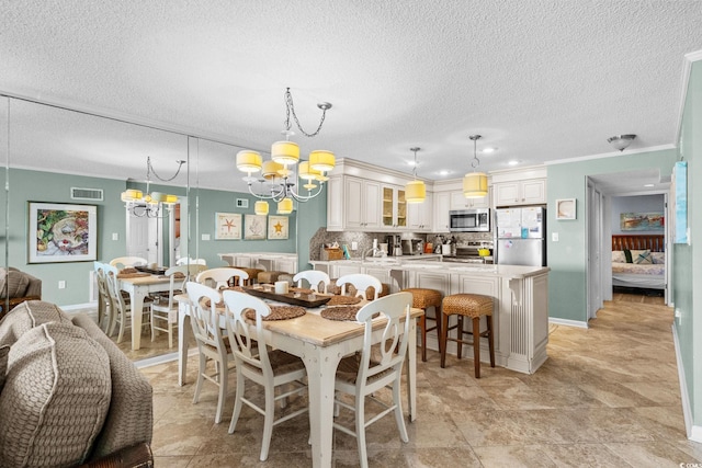 517 S Ocean Blvd Unit 705, North Myrtle Beach, SC 29582 - dining room featuring a chandelier, a textured ceiling, crown molding, and recessed lighting