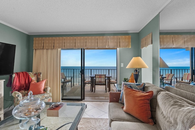 517 S Ocean Blvd Unit 705, North Myrtle Beach, SC 29582 - living area featuring a water view, crown molding, light tile patterned flooring, and a textured ceiling