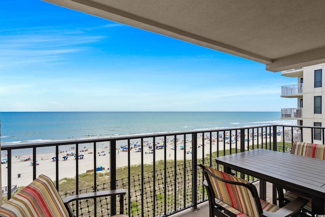 517 S Ocean Blvd Unit 705, North Myrtle Beach, SC 29582 - balcony featuring view of water and beach and outdoor dining space