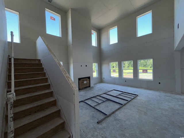 204 Valerio St, Myrtle Beach, SC 29579 - unfurnished living room featuring a high ceiling and stairway