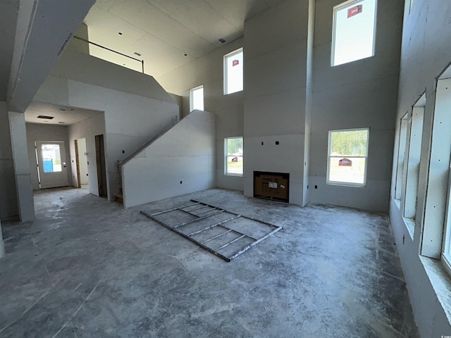 204 Valerio St, Myrtle Beach, SC 29579 - unfurnished living room with a towering ceiling and healthy amount of natural light