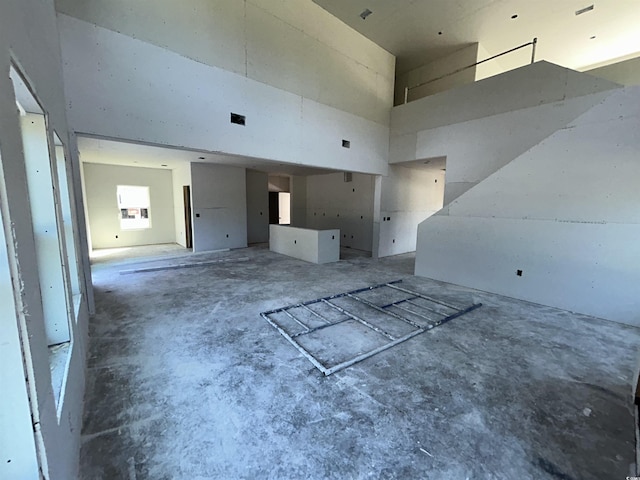 204 Valerio St, Myrtle Beach, SC 29579 - unfurnished living room with a towering ceiling and concrete floors