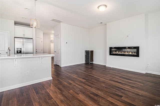 4051 Mclamb Ave Unit 4051, Little River, SC 29566 - unfurnished living room featuring a glass covered fireplace, dark wood finished floors, and recessed lighting