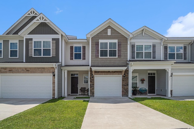 4051 Mclamb Ave Unit 4051, Little River, SC 29566 - multi unit property with a garage, driveway, stone siding, and a front yard