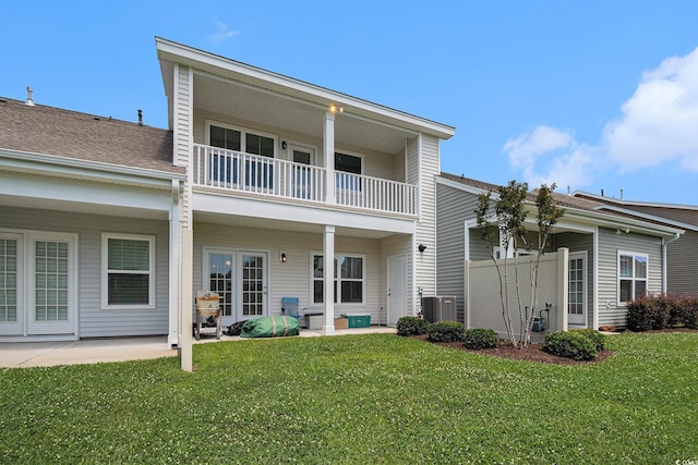 4051 Mclamb Ave Unit 4051, Little River, SC 29566 - back of house featuring a balcony, a patio area, and a yard