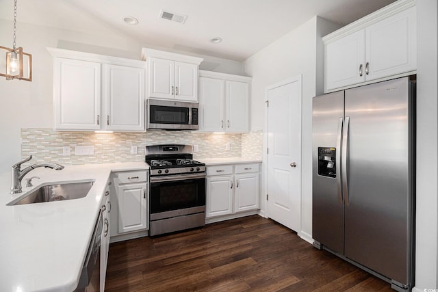 4051 Mclamb Ave Unit 4051, Little River, SC 29566 - kitchen featuring stainless steel appliances, dark wood-type flooring, tasteful backsplash, white cabinets, and recessed lighting