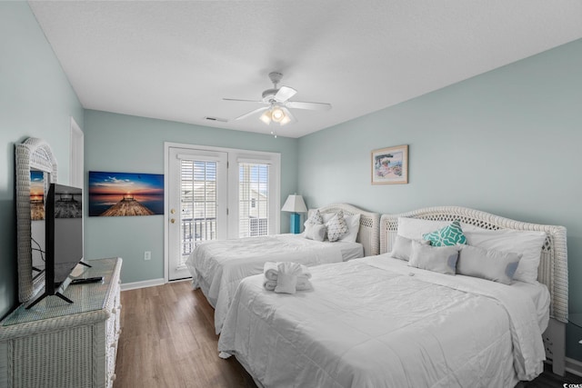 221 N Waccamaw Dr, Murrells Inlet, SC 29576 - bedroom featuring access to exterior, wood finished floors, and a ceiling fan