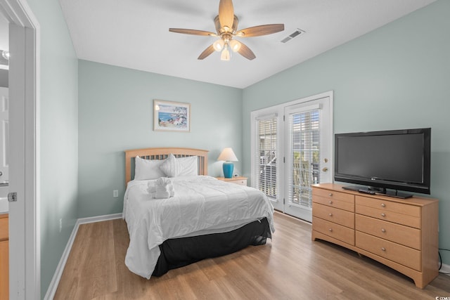 221 N Waccamaw Dr, Murrells Inlet, SC 29576 - bedroom featuring access to exterior, wood finished floors, and a ceiling fan