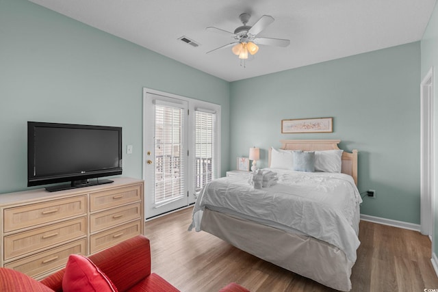221 N Waccamaw Dr, Murrells Inlet, SC 29576 - bedroom with access to outside, wood finished floors, and a ceiling fan
