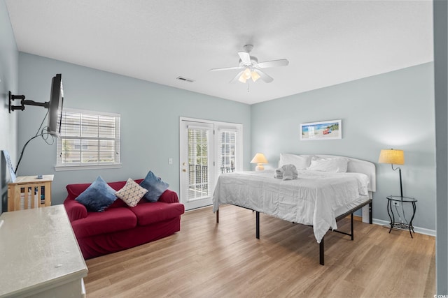 221 N Waccamaw Dr, Murrells Inlet, SC 29576 - bedroom featuring access to exterior, wood finished floors, and a ceiling fan