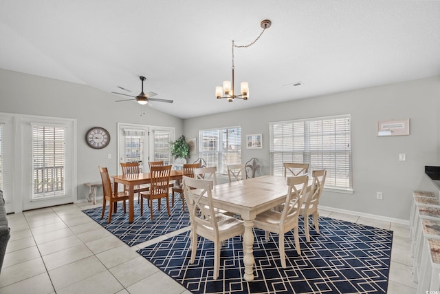 221 N Waccamaw Dr, Murrells Inlet, SC 29576 - dining room with light tile patterned floors, a ceiling fan, vaulted ceiling, and a chandelier