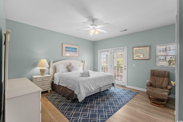 221 N Waccamaw Dr, Murrells Inlet, SC 29576 - bedroom with access to outside, wood finished floors, and a ceiling fan