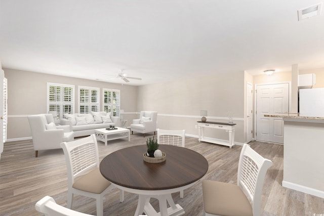 4645 Fringetree Dr Unit 10B, Murrells Inlet, SC 29576 - dining space featuring a ceiling fan and light wood finished floors