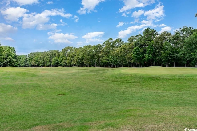 4645 Fringetree Dr Unit 10B, Murrells Inlet, SC 29576 - surrounding community with golf course view, a lawn, and view of wooded area
