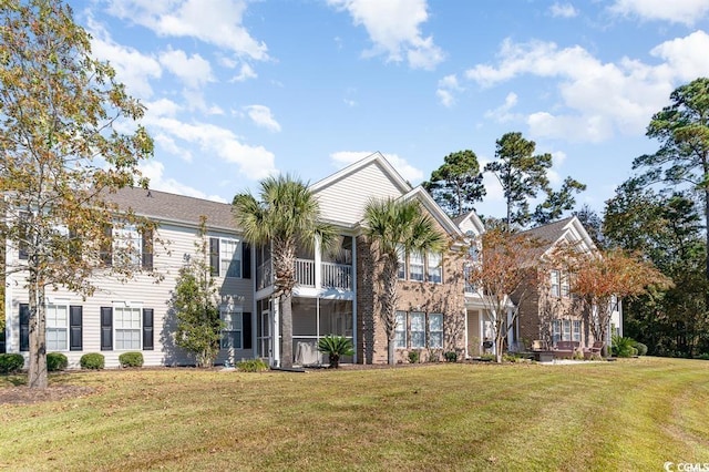4645 Fringetree Dr Unit 10B, Murrells Inlet, SC 29576 - view of front of house with a front lawn and a balcony