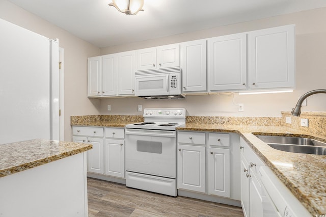 4645 Fringetree Dr Unit 10B, Murrells Inlet, SC 29576 - kitchen featuring white appliances, light wood finished floors, white cabinets, and light stone counters