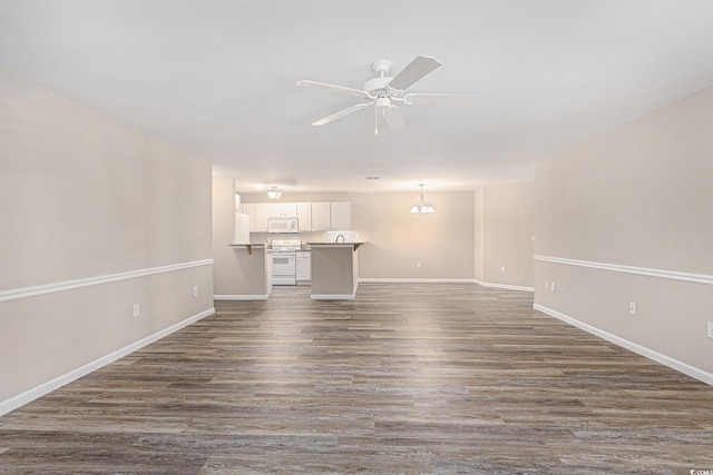 4645 Fringetree Dr Unit 10B, Murrells Inlet, SC 29576 - unfurnished living room with a ceiling fan and dark wood-style floors