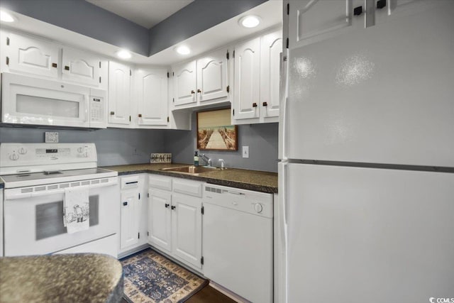 4222 Pinehurst Dr Unit I-9, Little River, SC 29566 - kitchen featuring white appliances, dark countertops, white cabinetry, and recessed lighting