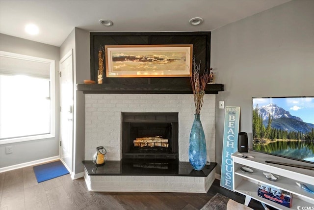 4222 Pinehurst Dr Unit I-9, Little River, SC 29566 - detailed view of a brick fireplace and wood finished floors