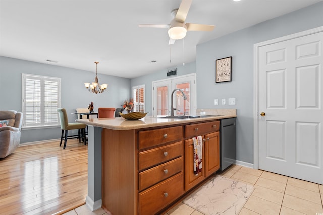864 Barn Owl Ct Unit 864, Myrtle Beach, SC 29579 - kitchen featuring dishwasher, brown cabinets, light countertops, a peninsula, and a chandelier