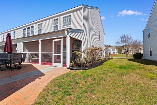 864 Barn Owl Ct Unit 864, Myrtle Beach, SC 29579 - back of house featuring a sunroom, a yard, and a patio area