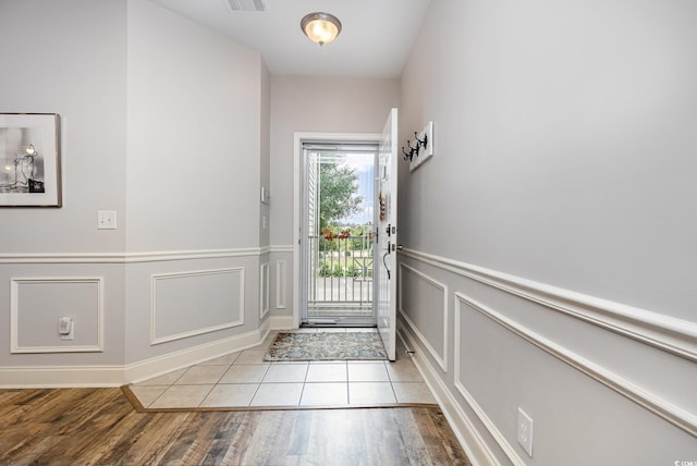 70 Addison Cottage Way Unit 216, Murrells Inlet, SC 29576 - entryway with wood finished floors, a decorative wall, and a wainscoted wall