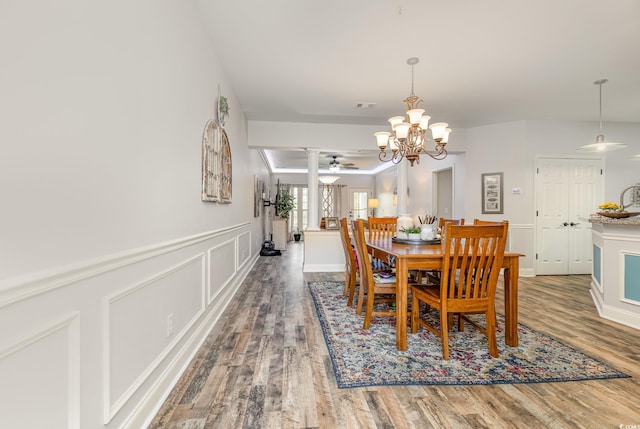 70 Addison Cottage Way Unit 216, Murrells Inlet, SC 29576 - dining space with wood finished floors, a chandelier, decorative columns, a wainscoted wall, and ceiling fan