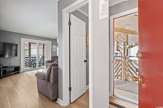 609 Hillside Dr S Unit D-17, North Myrtle Beach, SC 29582 - hallway featuring light wood finished floors and a textured ceiling