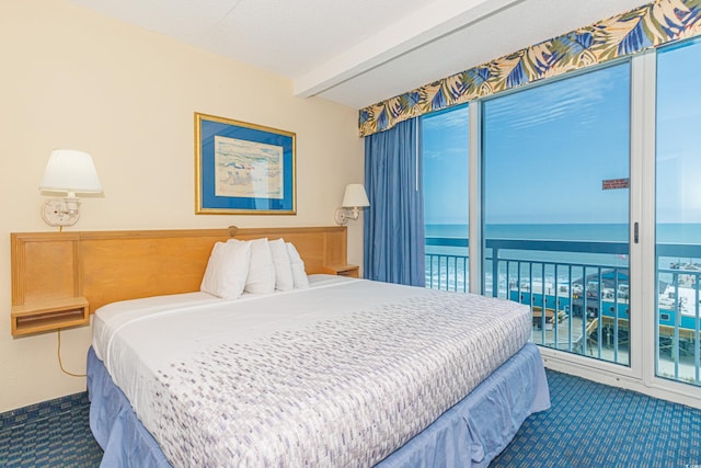 1304 N Ocean Blvd Unit 207, Myrtle Beach, SC 29577 - bedroom featuring carpet floors, access to exterior, a water view, and beamed ceiling