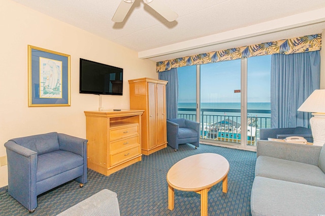 1304 N Ocean Blvd Unit 207, Myrtle Beach, SC 29577 - carpeted living area with ceiling fan