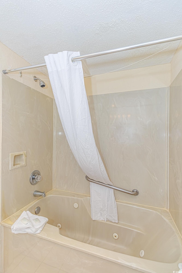 1304 N Ocean Blvd Unit S-204, Myrtle Beach, SC 29577 - bathroom with a combined bath / shower with jetted tub and a textured ceiling