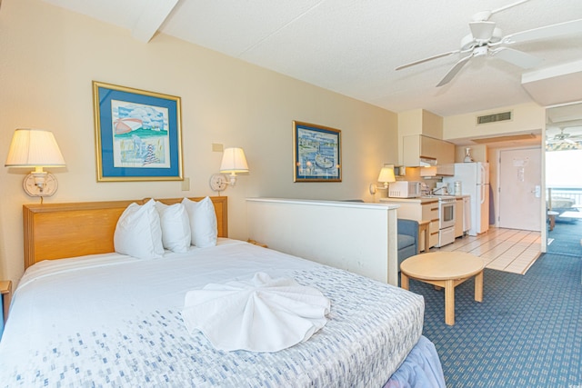 1304 N Ocean Blvd Unit S-204, Myrtle Beach, SC 29577 - bedroom featuring freestanding refrigerator, light colored carpet, and a ceiling fan