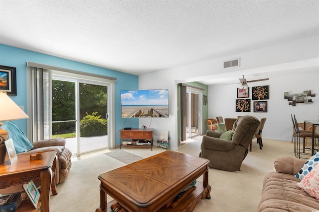 500 Eagle Way Unit 19, Little River, SC 29566 - living room featuring light carpet, a textured ceiling, and a ceiling fan