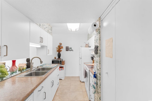 500 Eagle Way Unit 19, Little River, SC 29566 - kitchen featuring stainless steel microwave, white cabinetry, white electric range oven, light countertops, and light tile patterned floors