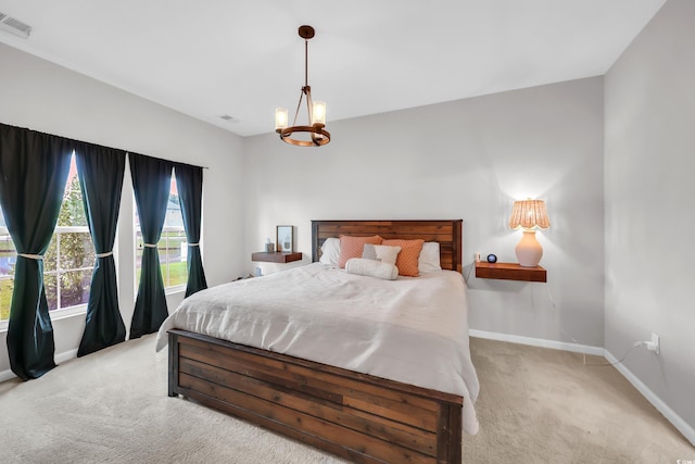 1276 Brighton Hill Ave, Myrtle Beach, SC 29588 - bedroom with light colored carpet and a chandelier