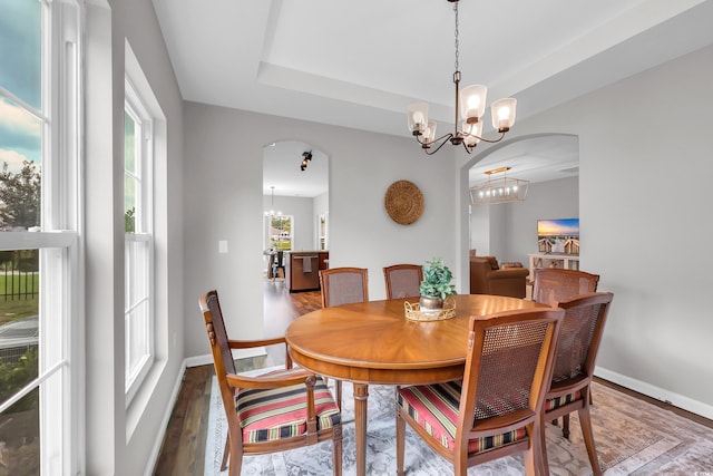1276 Brighton Hill Ave, Myrtle Beach, SC 29588 - dining room featuring a chandelier, arched walkways, and wood finished floors