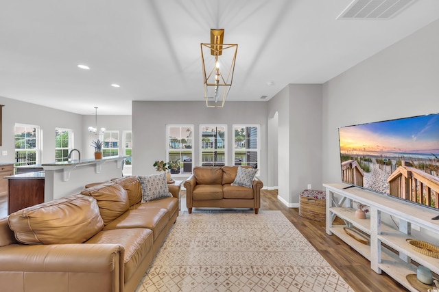 1276 Brighton Hill Ave, Myrtle Beach, SC 29588 - living area featuring recessed lighting, a chandelier, and wood finished floors