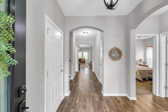 1276 Brighton Hill Ave, Myrtle Beach, SC 29588 - hall with arched walkways and dark wood-style flooring