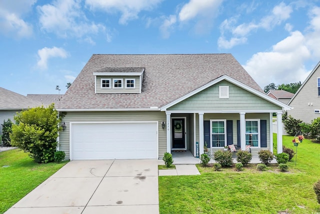 1276 Brighton Hill Ave, Myrtle Beach, SC 29588 - view of front facade with a porch, a garage, driveway, a front yard, and roof with shingles