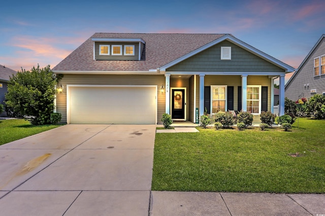 1276 Brighton Hill Ave, Myrtle Beach, SC 29588 - view of front of home featuring a porch, a front lawn, roof with shingles, and driveway