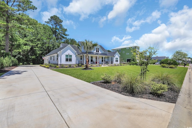 137 Pottery Landing Dr, Conway, SC 29527 - view of front facade with driveway, a porch, and a front lawn