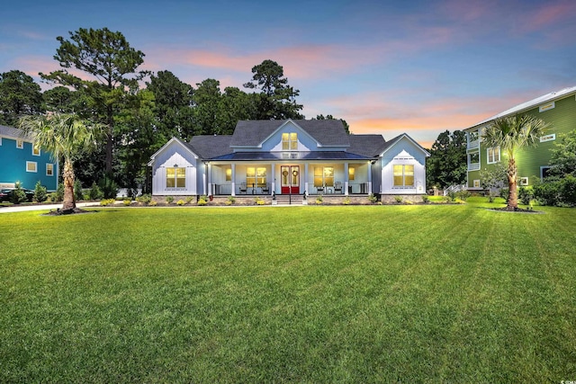137 Pottery Landing Dr, Conway, SC 29527 - view of front facade featuring a porch, a front yard, and board and batten siding