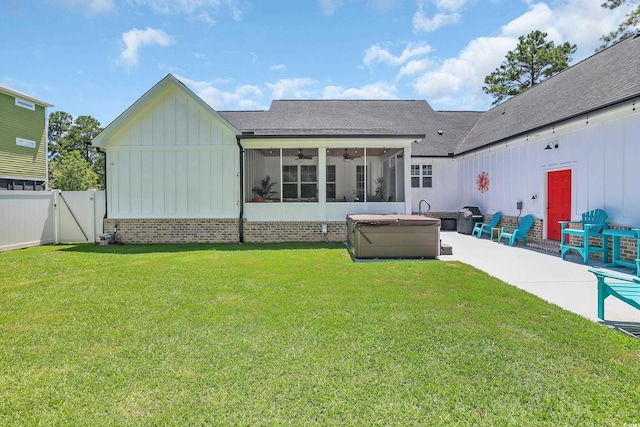 137 Pottery Landing Dr, Conway, SC 29527 - back of property featuring board and batten siding, a hot tub, ceiling fan, a shingled roof, and a patio