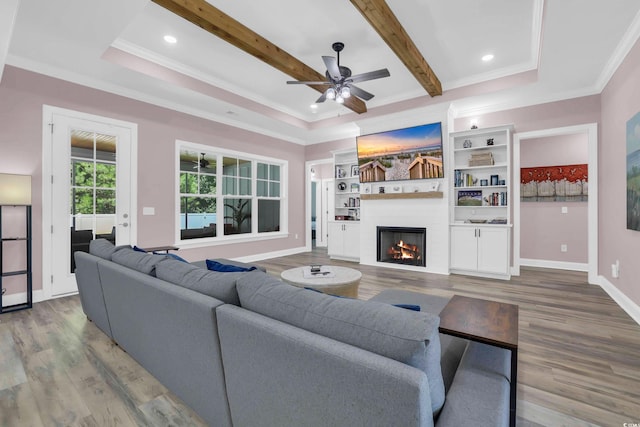 137 Pottery Landing Dr, Conway, SC 29527 - living room featuring a large fireplace, ceiling fan, crown molding, wood finished floors, and beamed ceiling