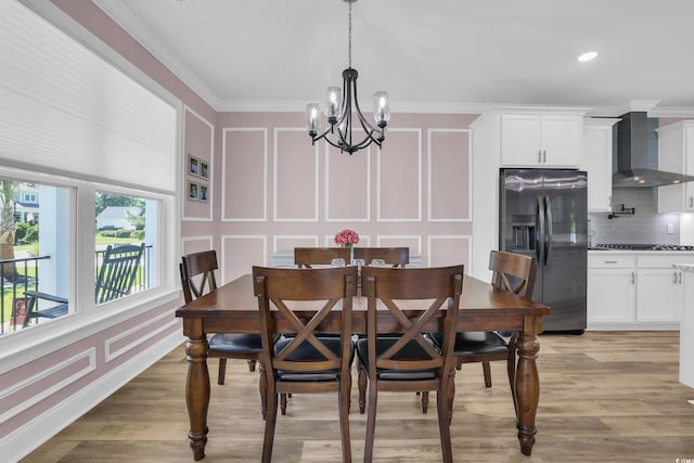 137 Pottery Landing Dr, Conway, SC 29527 - dining area featuring a decorative wall, a chandelier, ornamental molding, light wood-type flooring, and recessed lighting