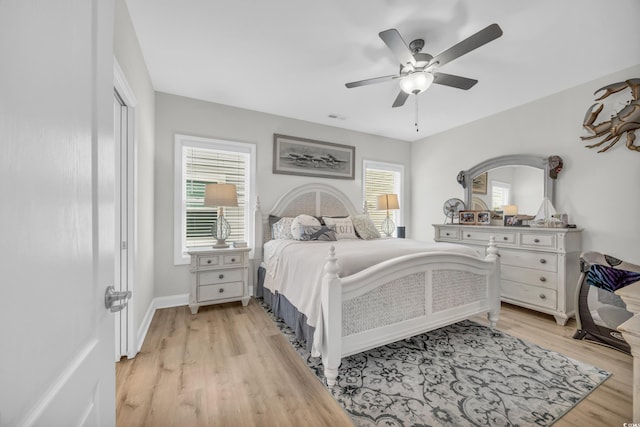 146 Marblehead Dr, Little River, SC 29566 - bedroom featuring multiple windows, light wood-style floors, and a ceiling fan